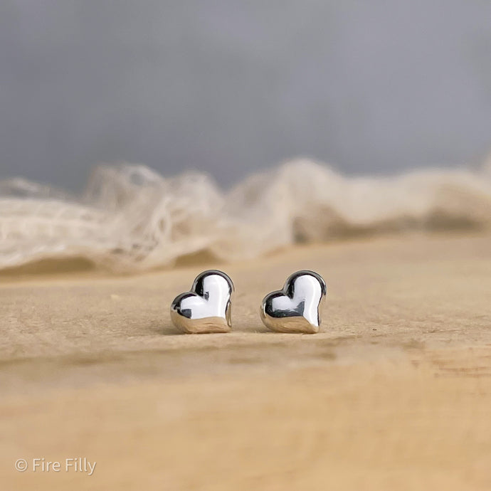 PUFFY SILVER HEART STUDS